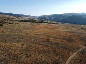 View of mountain backdrop with rural landscape