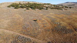 View of property location featuring a mountain backdrop and rural landscape