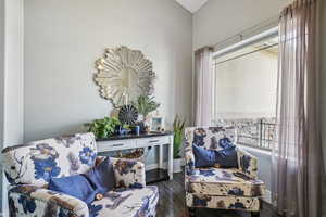 Living area featuring plenty of natural light and dark wood-style flooring