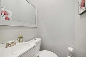 Bathroom with toilet and vanity