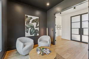 Sitting room featuring wood finished floors and recessed lighting