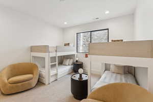 Bedroom with carpet floors and recessed lighting