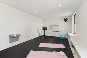 Workout area featuring recessed lighting