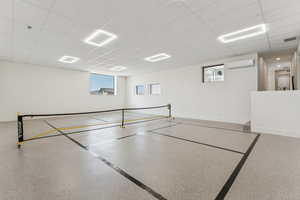 View of property's community with a paneled ceiling