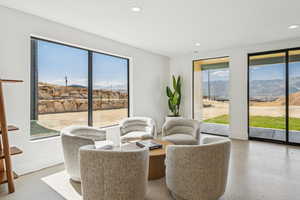 Sitting room with a mountain view and recessed lighting