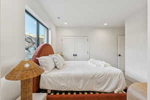 Bedroom featuring a closet, recessed lighting, and carpet floors