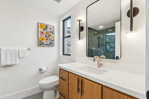 Bathroom with vanity and a stall shower