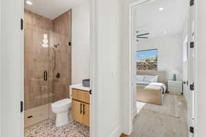 Full bath featuring a stall shower, vanity, recessed lighting, ensuite bath, and light wood finished floors
