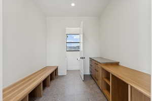 Mudroom with recessed lighting and baseboards