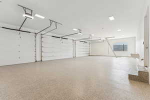 Garage featuring a garage door opener