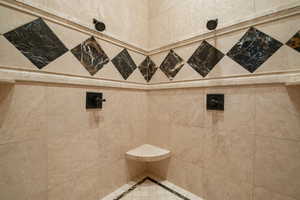 Full bath with a tile shower