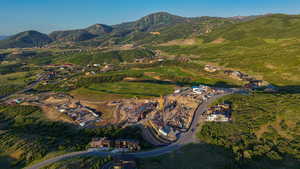 Aerial overview of property's location featuring a mountain backdrop