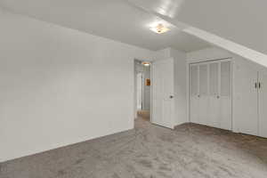 Unfurnished bedroom featuring carpet floors and a closet