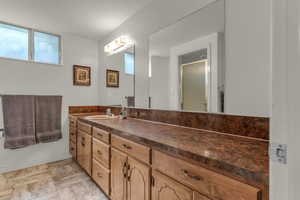 Bathroom with vanity and a stall shower