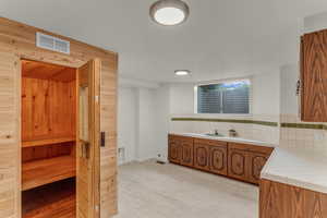 Large laundry room, with dry sauna and plenty of cabinets