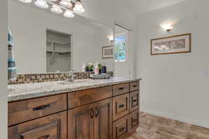 Primary Bathroom New cabinets, countertop and backsplash and walk in closet