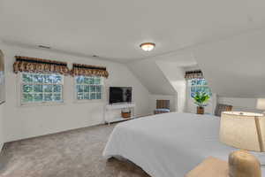 Upstairs primary bedroom with sitting area
