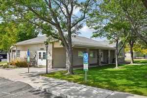 View of property with concrete driveway