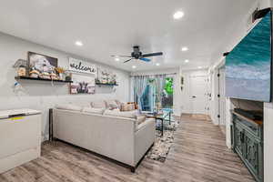 Living area featuring recessed lighting, light wood-type flooring, and ceiling fan