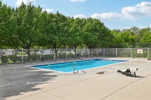 Community pool with a patio area