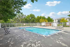 Community pool featuring a patio area