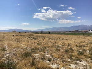 View of mountain backdrop featuring rural landscape