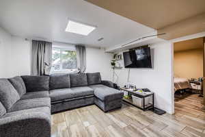 Living area featuring wood tiled floors