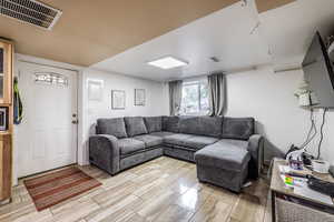 Living area with wood tiled floors