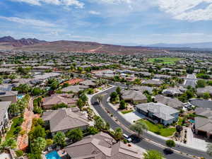 Aerial view of residential area with a mountainous background