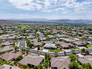 Aerial perspective of suburban area featuring a mountainous background