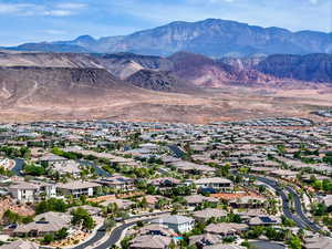 Aerial perspective of suburban area featuring a mountain backdrop