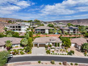 Aerial perspective of suburban area featuring a mountain backdrop