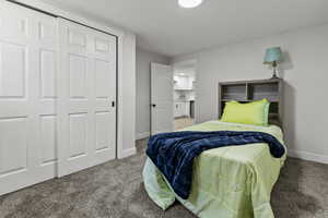 Bedroom with carpet floors and a closet