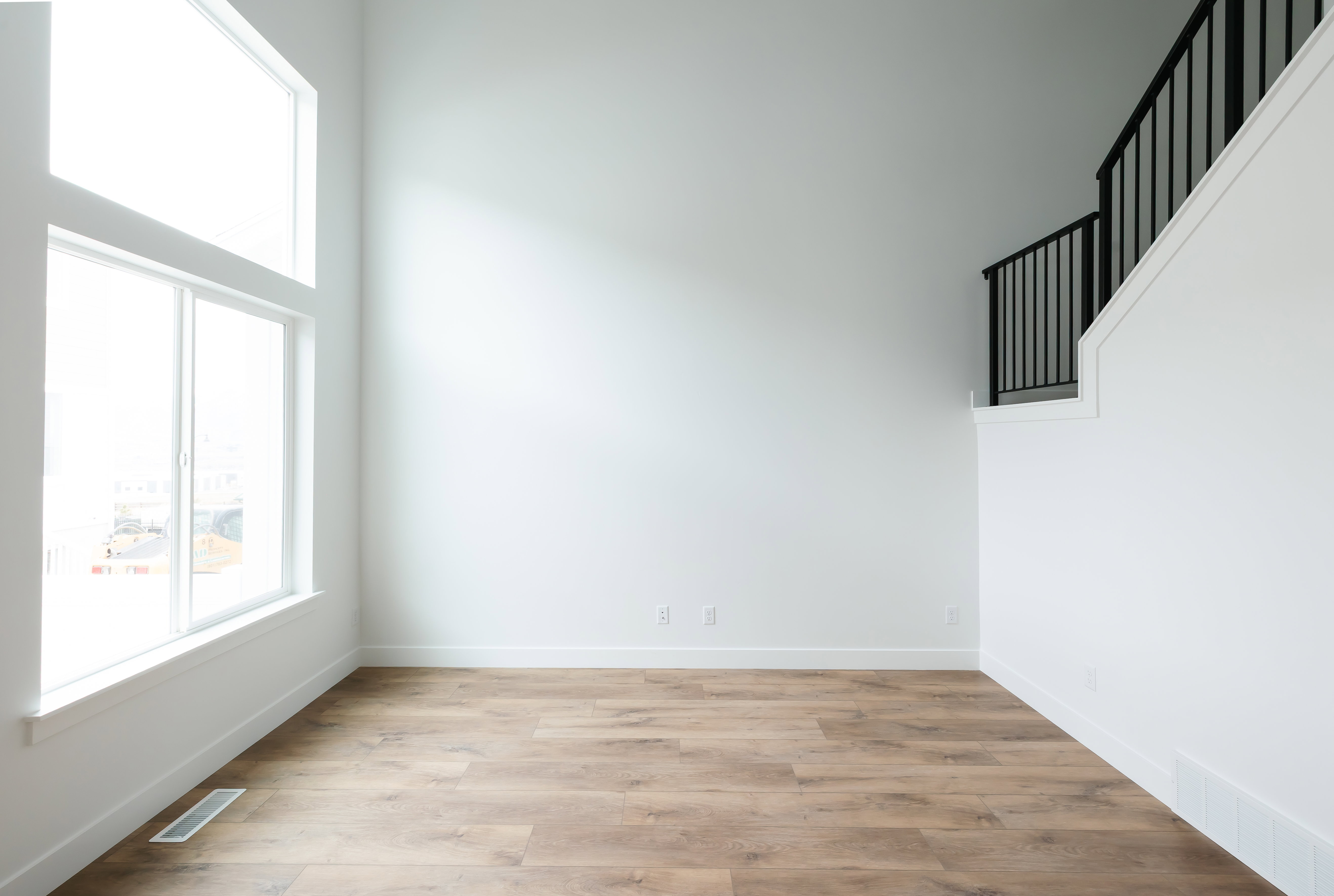 Empty room with light wood-type flooring and baseboards