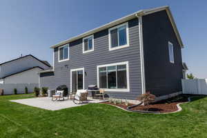 Back of house with a patio