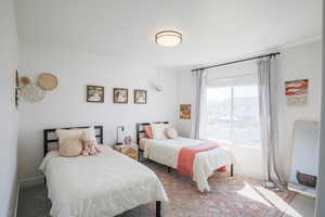 Bedroom with carpet and baseboards