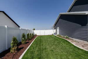 View of fenced backyard
