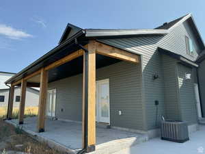 Back of house with a patio