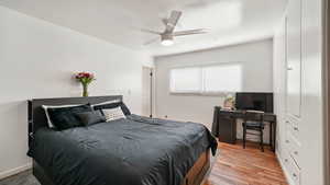 Bedroom featuring light wood-style floors and a ceiling fan