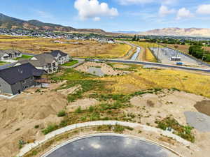 Aerial perspective of suburban area featuring a mountain backdrop