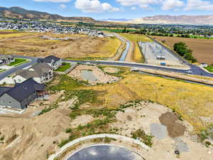 Aerial view of residential area featuring a mountain backdrop