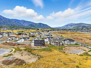 Aerial perspective of suburban area with a mountain backdrop