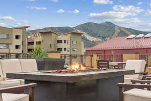Patio / terrace featuring a mountain view and a fire pit