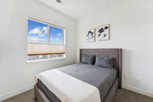 Bedroom with carpet and baseboards