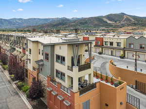View of building exterior featuring a residential view and a mountain view