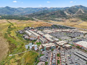 Aerial view of property's location with a mountain backdrop