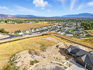 Aerial view of residential area featuring a mountainous background