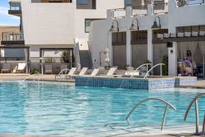 Community pool with a patio area