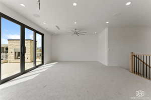 Empty room with recessed lighting, light colored carpet, and a ceiling fan