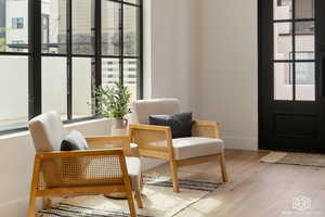 Sitting room with healthy amount of natural light and wood finished floors